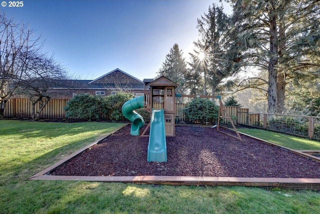 view of jungle gym featuring a lawn