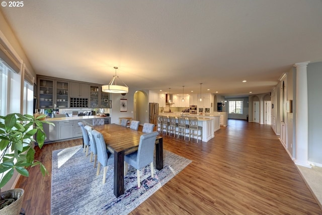 dining area featuring dark wood-type flooring