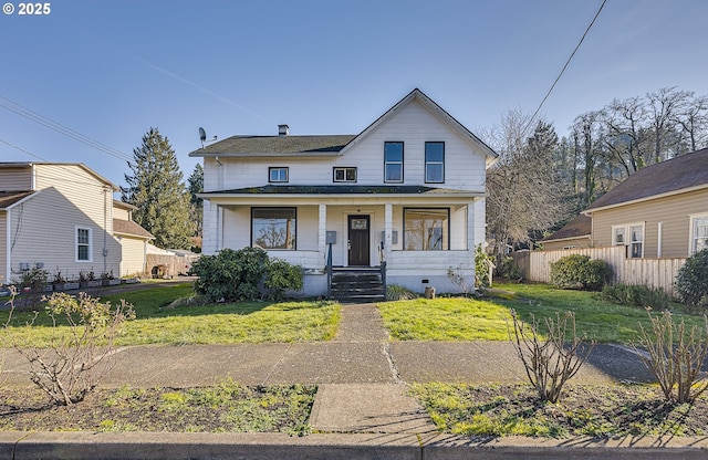 bungalow-style home featuring a front lawn and covered porch