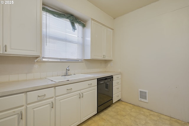 kitchen with dishwasher, sink, and white cabinets