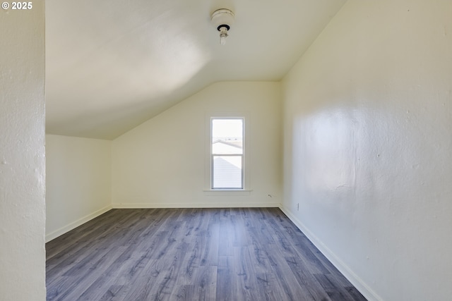 bonus room featuring hardwood / wood-style floors and vaulted ceiling