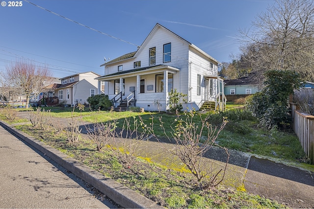 view of front facade featuring a front lawn and a porch