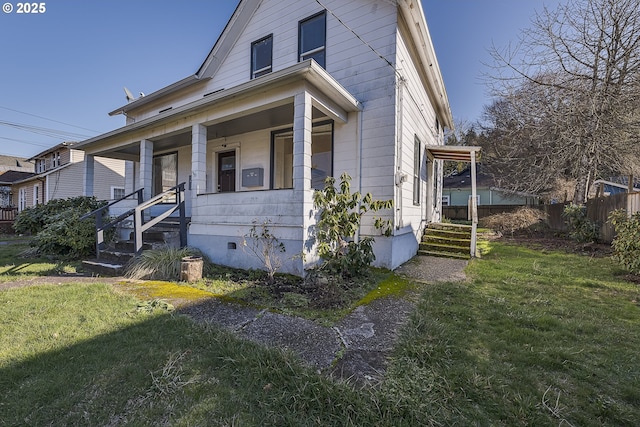 bungalow-style home with a porch and a front lawn