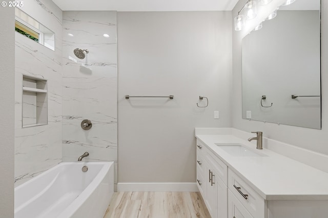 5477 SE Golden Rd, Hillsboro, OR 97123 - bathroom featuring vanity, baseboards, bathing tub / shower combination, and wood finished floors
