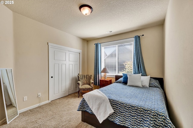 12626 Tradewind St, Oregon City, OR 97045 - bedroom with carpet, a textured ceiling, a closet, and baseboards