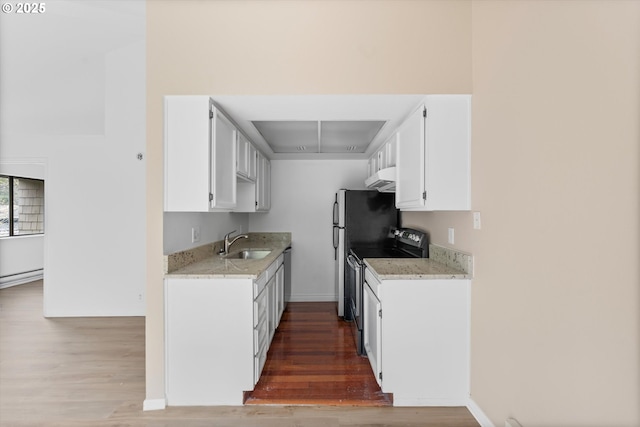 kitchen featuring white cabinets, dark wood-type flooring, sink, and black / electric stove