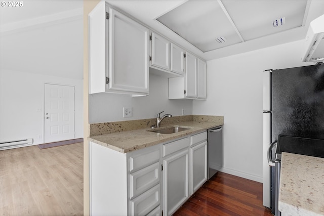 kitchen featuring dishwasher, hardwood / wood-style flooring, white cabinetry, and sink