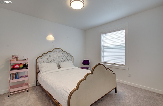 bedroom featuring baseboards and carpet flooring