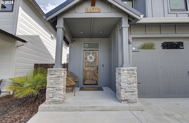 doorway to property featuring board and batten siding and a porch