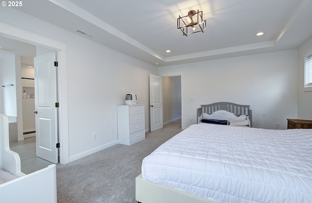 bedroom with a raised ceiling, light colored carpet, baseboards, visible vents, and recessed lighting