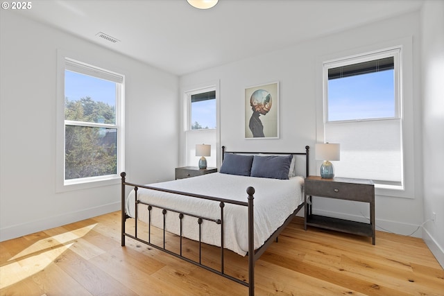 8466 NW Coast Rd, Seal Rock, OR 97376 - bedroom featuring baseboards and wood finished floors
