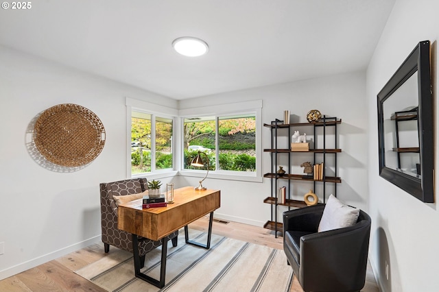 office space with light hardwood / wood-style floors