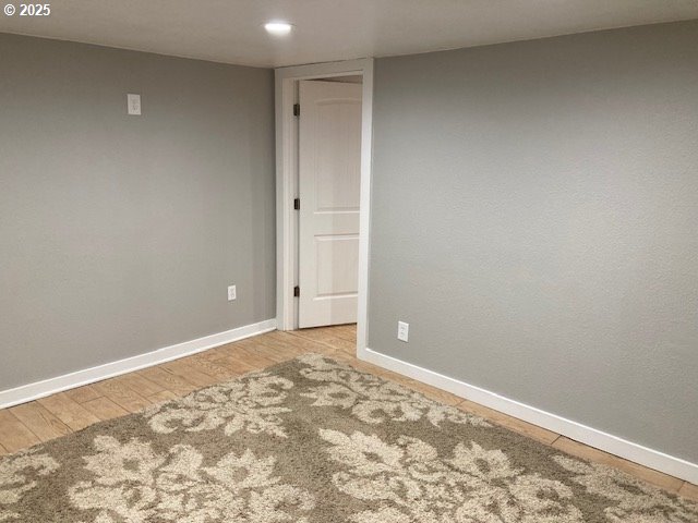 100 NW 7th Ave, John Day, OR 97845 - empty room featuring light wood-style floors, baseboards, and recessed lighting