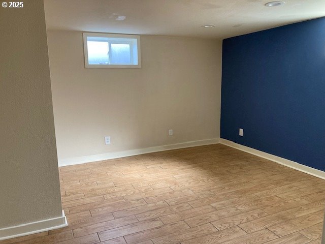 100 NW 7th Ave, John Day, OR 97845 - unfurnished room with wood finished floors and baseboards