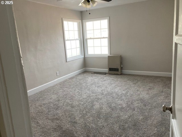 100 NW 7th Ave, John Day, OR 97845 - spare room with a ceiling fan, baseboards, and carpet floors