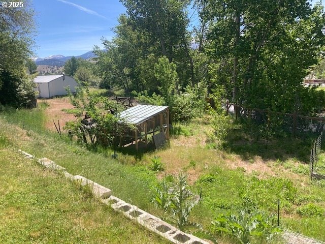 100 NW 7th Ave, John Day, OR 97845 - view of yard with a mountain view and an outdoor structure