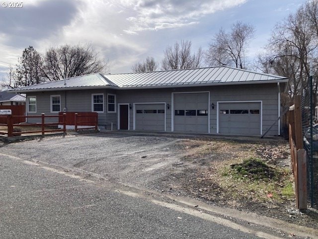 100 NW 7th Ave, John Day, OR 97845 - single story home featuring driveway, an attached garage, and metal roof