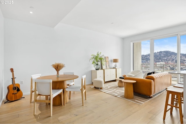 interior space featuring baseboards, recessed lighting, and light wood-style floors