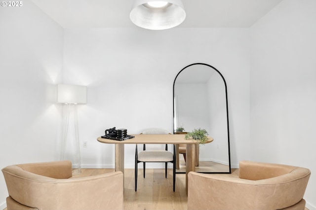 sitting room featuring light wood-type flooring and baseboards