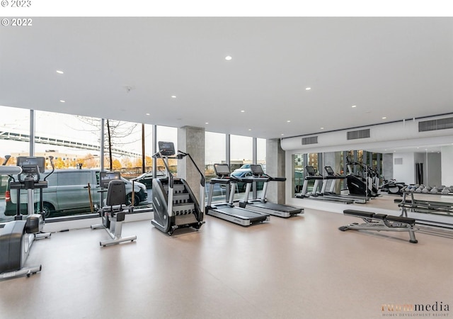 exercise room with expansive windows and visible vents