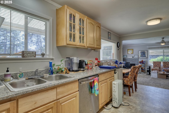 kitchen featuring a sink, light brown cabinetry, dishwasher, and light countertops