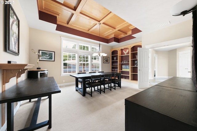 dining area featuring coffered ceiling, a chandelier, light colored carpet, and baseboards