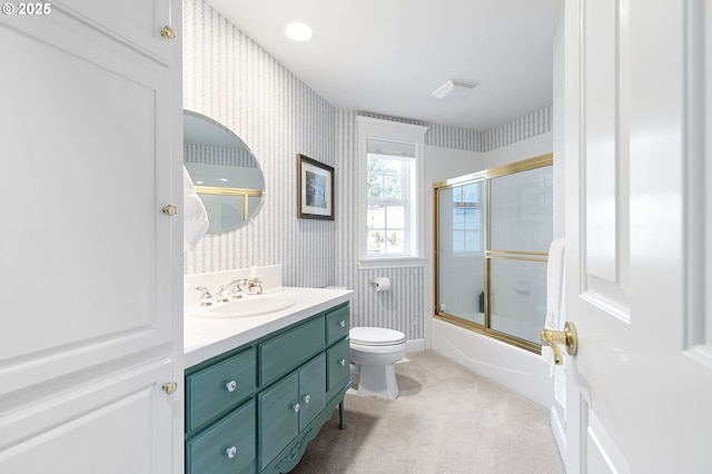 bathroom with visible vents, toilet, combined bath / shower with glass door, wallpapered walls, and vanity