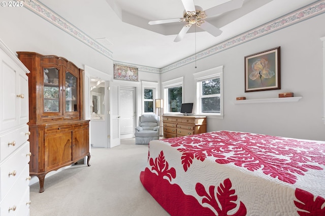 carpeted bedroom featuring a ceiling fan and visible vents