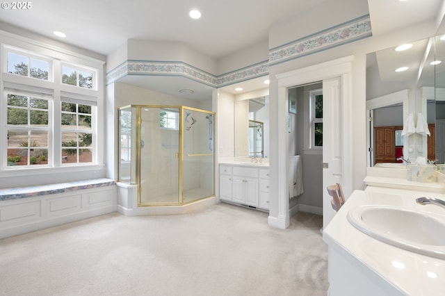 bathroom featuring recessed lighting, a stall shower, vanity, and baseboards