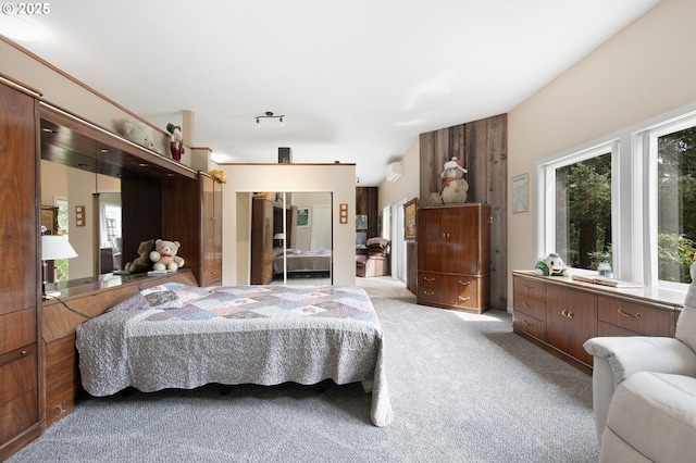 bedroom featuring light colored carpet