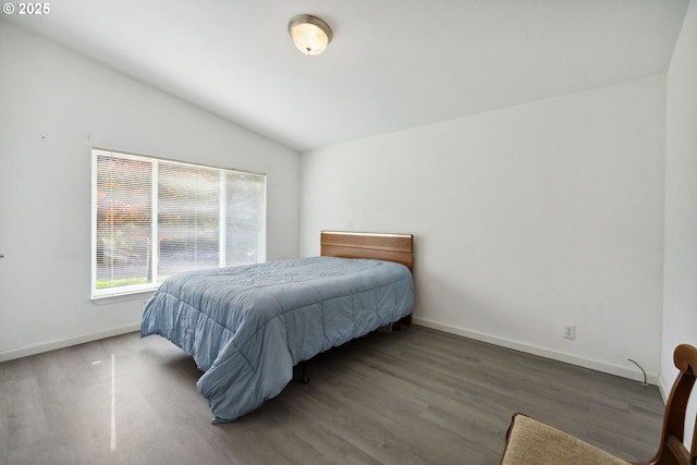 68226 Iris Rd, North Bend, OR 97459 - bedroom featuring lofted ceiling, wood finished floors, and baseboards