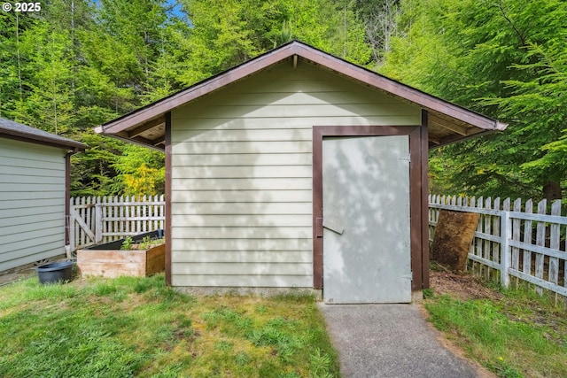 68226 Iris Rd, North Bend, OR 97459 - view of shed with fence and a forest view