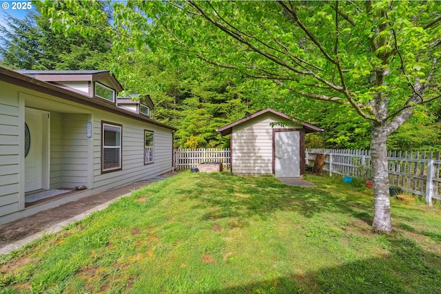 68226 Iris Rd, North Bend, OR 97459 - view of yard with a storage unit and an outbuilding