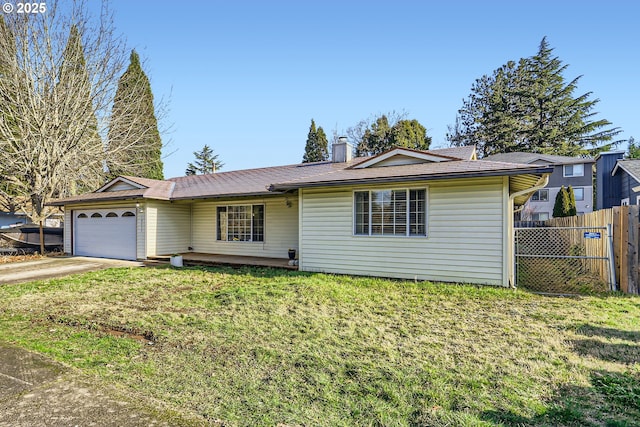 ranch-style home featuring a garage and a front lawn