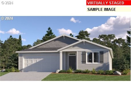 view of front facade featuring a front lawn and a garage