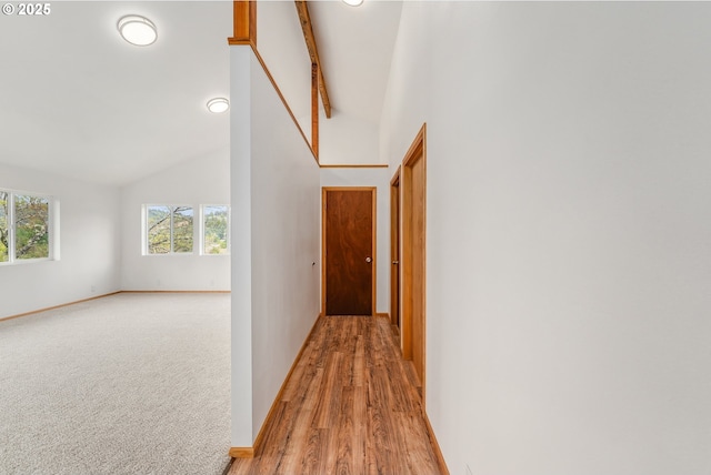 250 Valley View Rd, Sutherlin, OR 97479 - hallway with high vaulted ceiling, baseboards, and light wood-style flooring
