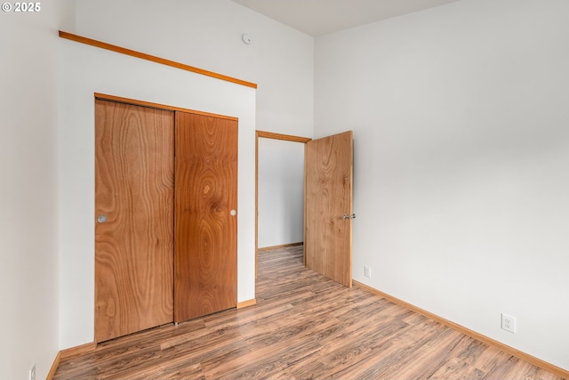 250 Valley View Rd, Sutherlin, OR 97479 - unfurnished bedroom featuring wood finished floors, a closet, and baseboards