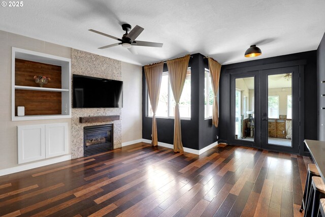 5416 Wales Dr, Eugene, OR 97402 - unfurnished living room with healthy amount of natural light, a fireplace, a ceiling fan, and wood finished floors