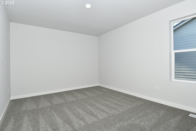 empty room featuring carpet flooring