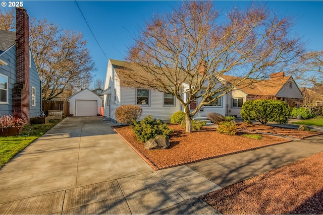 view of front of home with an outbuilding and a garage