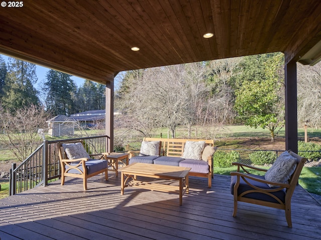 wooden deck with an outdoor living space