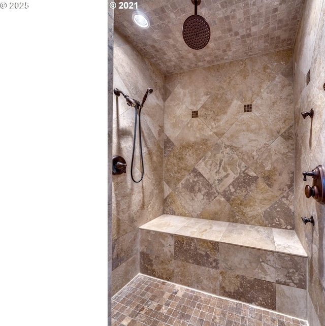 bathroom with tiled shower