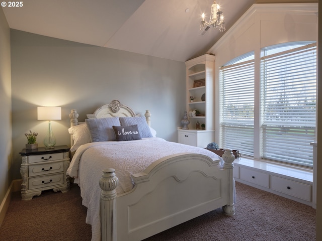 bedroom with dark colored carpet, vaulted ceiling, and an inviting chandelier