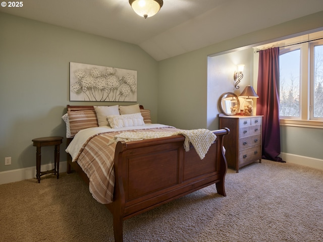 carpeted bedroom with vaulted ceiling