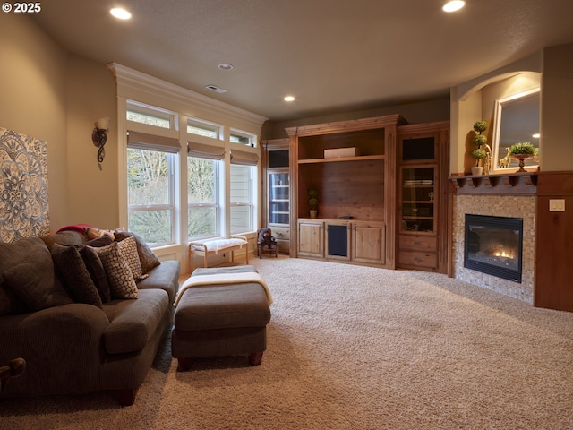 carpeted living room featuring a fireplace