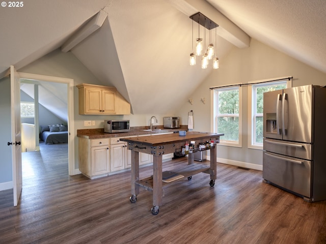 kitchen featuring stainless steel appliances, dark wood-type flooring, sink, and decorative light fixtures