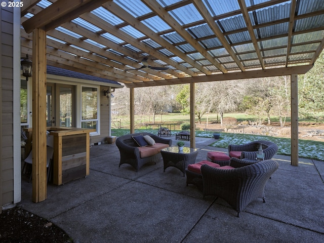 view of patio with an outdoor living space and a pergola