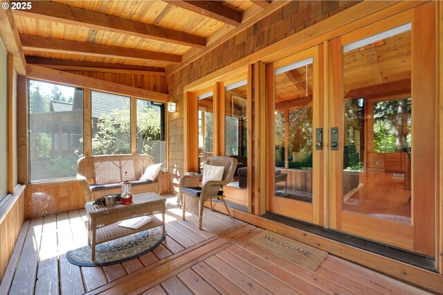 sunroom with french doors and beamed ceiling