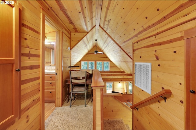 bonus room featuring wooden walls, wood finished floors, lofted ceiling, visible vents, and wood ceiling