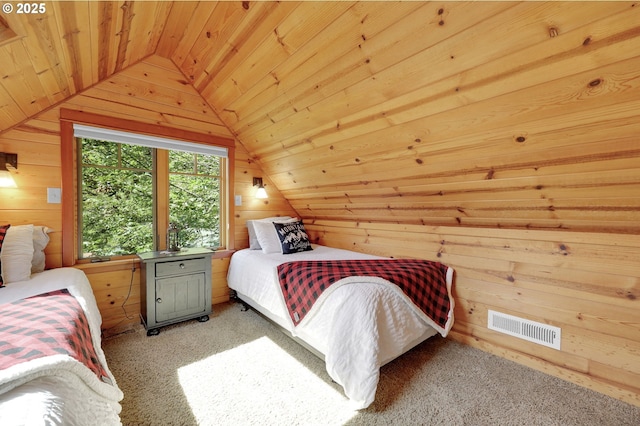 bedroom featuring wooden ceiling, lofted ceiling, wood walls, and visible vents